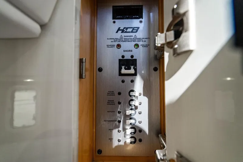  Yacht Photos Pics Electrical panel inside 2024 HCB 42 Lujo boat, showcasing circuit breakers and controls.