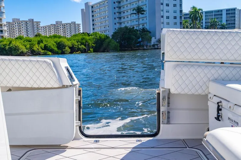  Yacht Photos Pics 2024 HCB 42 Lujo boat with open deck, overlooking water and cityscape.