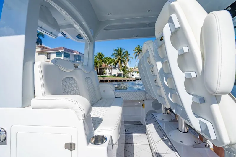  Yacht Photos Pics Luxurious interior of 2024 HCB 42 Lujo boat with white seating and waterfront view.