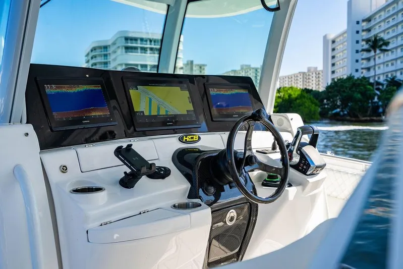  Yacht Photos Pics Helm of 2024 HCB 42 Lujo boat with advanced navigation displays.