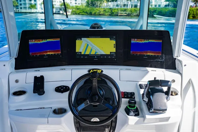  Yacht Photos Pics 2024 HCB 42 Lujo boat dashboard with advanced navigation displays and controls.