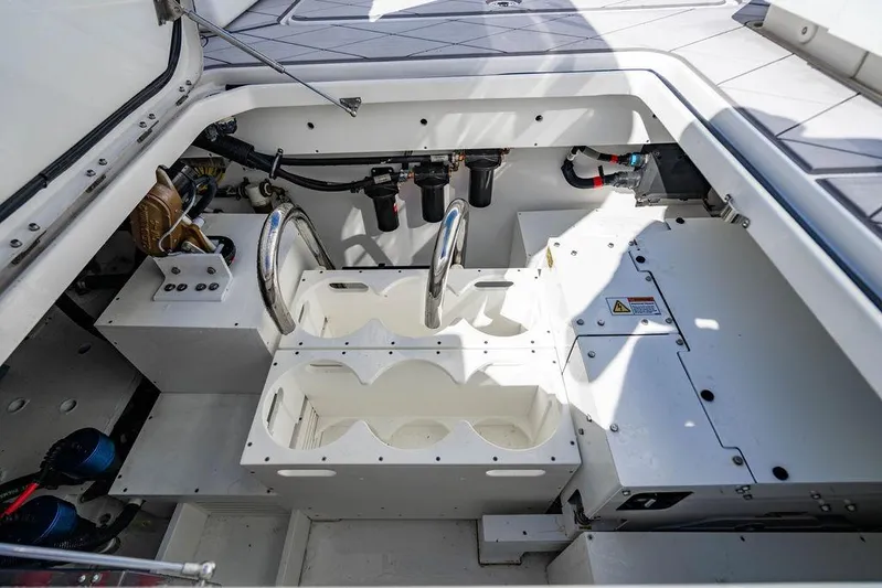  Yacht Photos Pics Engine compartment of 2024 HCB 42 Lujo boat, showcasing mechanical components and storage areas.