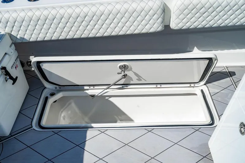  Yacht Photos Pics 2024 HCB 42 Lujo boat storage compartment with quilted seating and open hatch.