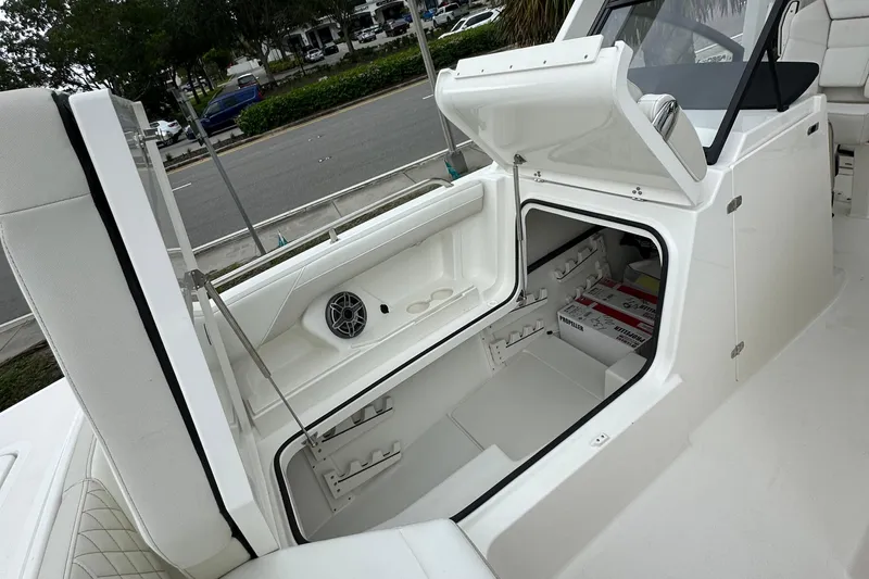  Yacht Photos Pics 2025 World Cat 260 DC-X boat interior storage compartment with open hatch.