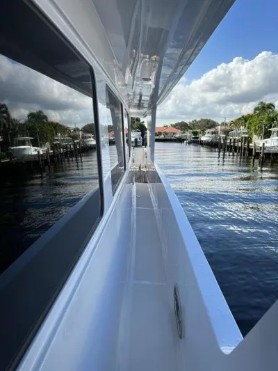 Glen Ellen Yacht Photos Pics Side deck view of a 2002 President 100 Motor Yacht on a sunny day.