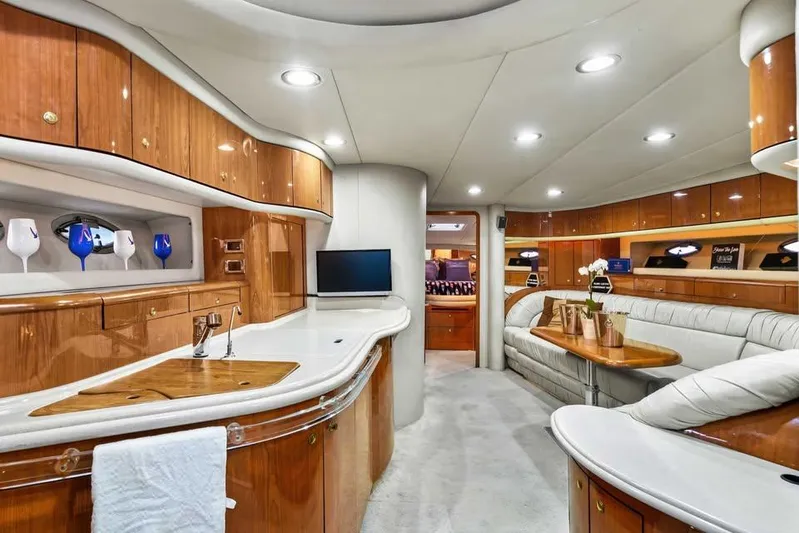  Yacht Photos Pics Luxurious interior of 2000 Sea Ray 540 Sundancer yacht with elegant wood finishes and modern amenities.