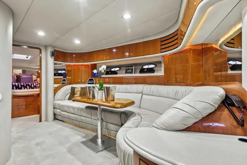  Yacht Photos Pics Luxurious interior of 2000 Sea Ray 540 Sundancer yacht with plush seating and elegant wood finishes.