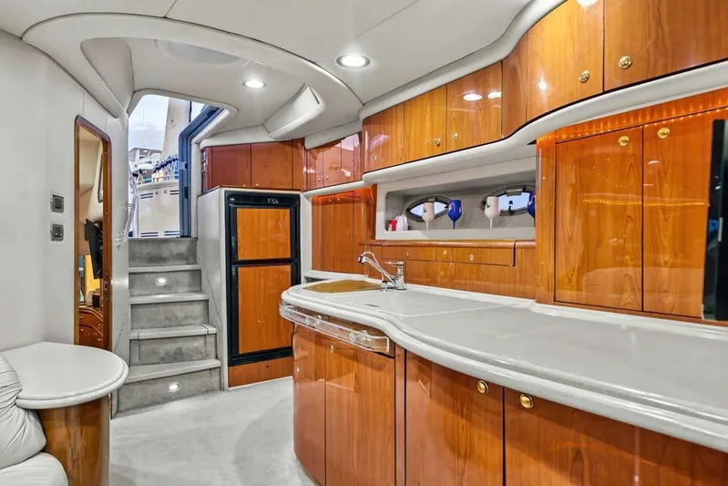  Yacht Photos Pics Luxurious interior of 2000 Sea Ray 540 Sundancer yacht with elegant wood cabinetry.