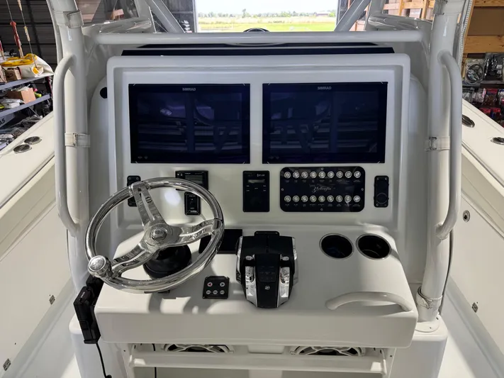  Yacht Photos Pics 2020 Yellowfin 36 Offshore boat console with dual Simrad displays and steering wheel.