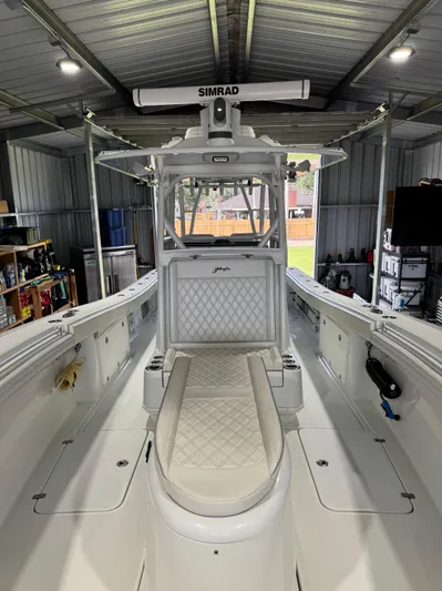  Yacht Photos Pics 2020 Yellowfin 36 Offshore boat interior in a garage, featuring Simrad electronics.