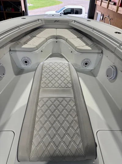  Yacht Photos Pics 2020 Yellowfin 36 Offshore boat interior with diamond-stitched seating and speakers.