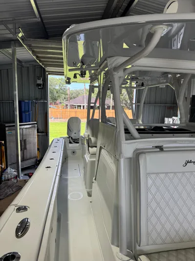  Yacht Photos Pics 2020 Yellowfin 36 Offshore boat in a covered storage area.