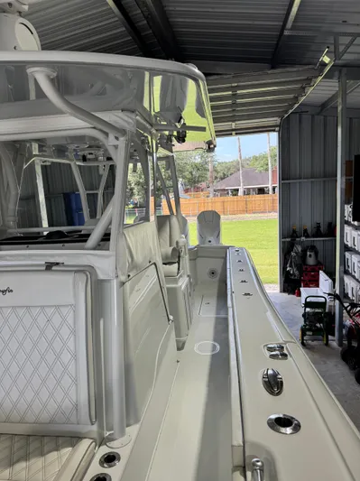  Yacht Photos Pics 2020 Yellowfin 36 Offshore boat in a garage, showcasing sleek design and spacious interior.