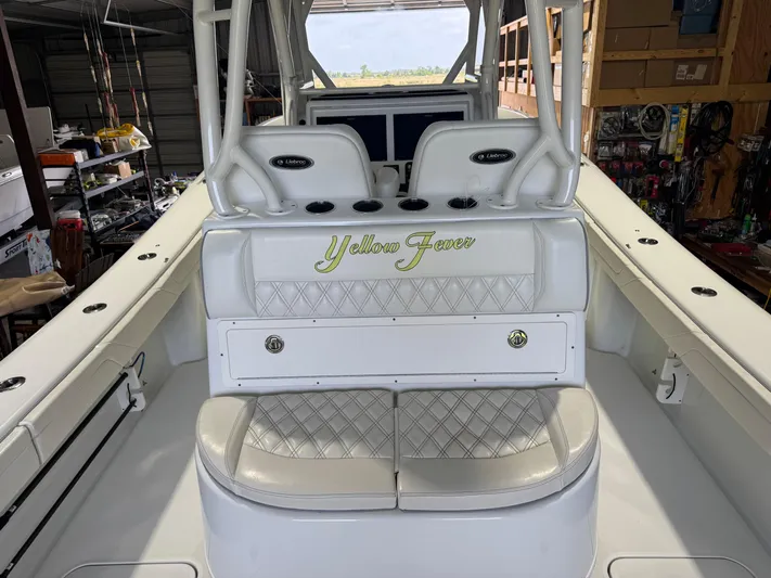  Yacht Photos Pics 2020 Yellowfin 36 Offshore boat interior with "Yellow Fever" seating in a garage setting.
