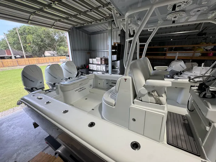  Yacht Photos Pics 2020 Yellowfin 36 Offshore boat with Mercury engines in a garage setting.