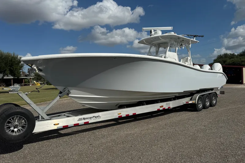  Yacht Photos Pics 2020 Yellowfin 36 Offshore boat on trailer under blue sky.