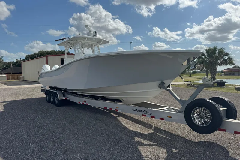  Yacht Photos Pics 2020 Yellowfin 36 Offshore boat on trailer under a sunny sky.