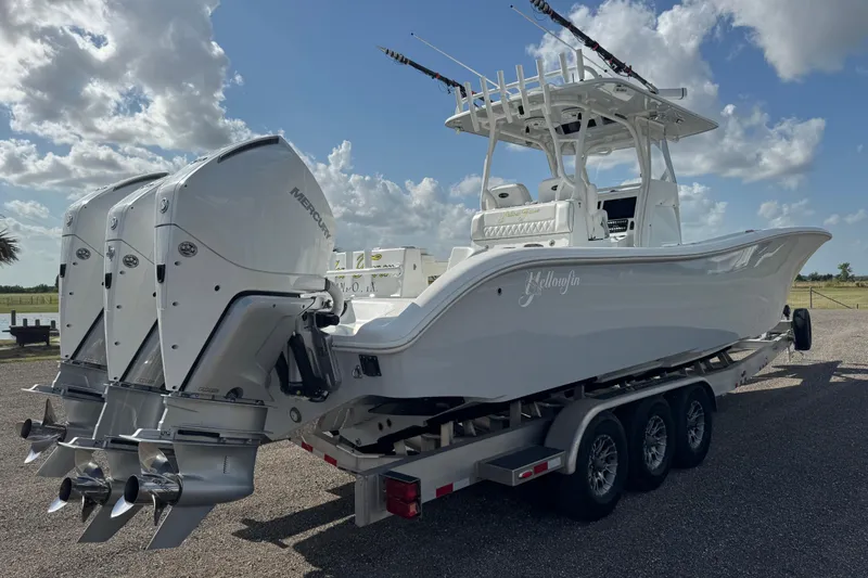  Yacht Photos Pics 2020 Yellowfin 36 Offshore boat with triple Mercury engines on a trailer.