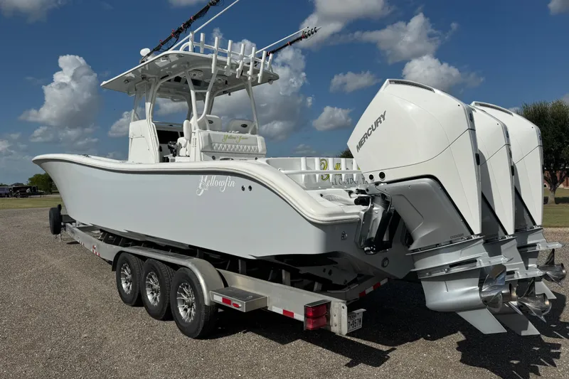 Yacht Photos Pics 2020 Yellowfin 36 Offshore boat with triple Mercury engines on a trailer.