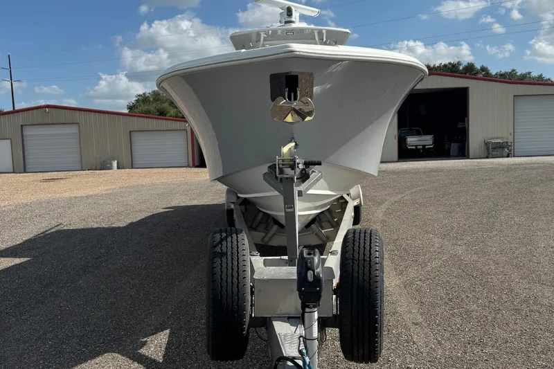  Yacht Photos Pics 2020 Yellowfin 36 Offshore boat on trailer, parked outside storage units.