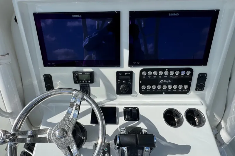  Yacht Photos Pics 2020 Yellowfin 36 Offshore boat dashboard with dual Simrad displays and control panel.
