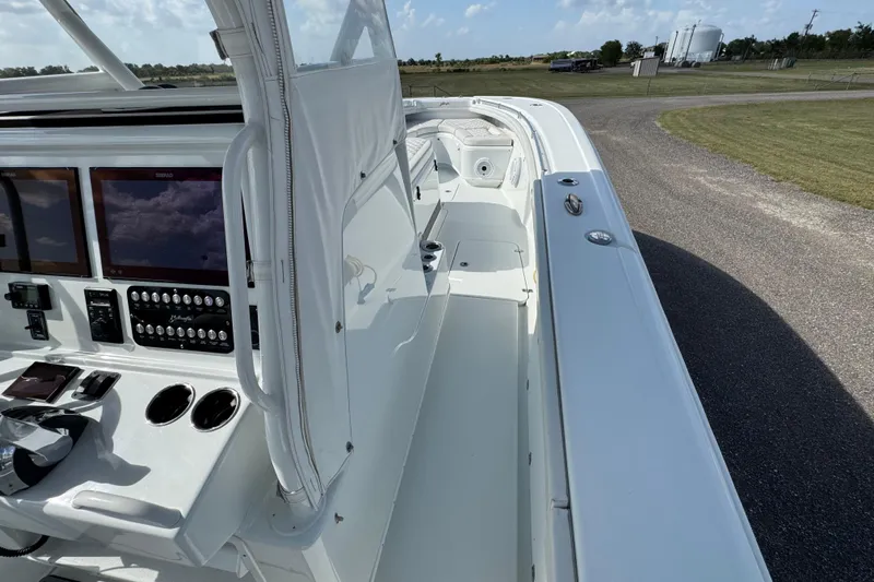  Yacht Photos Pics 2020 Yellowfin 36 Offshore boat interior with control panel and seating area.