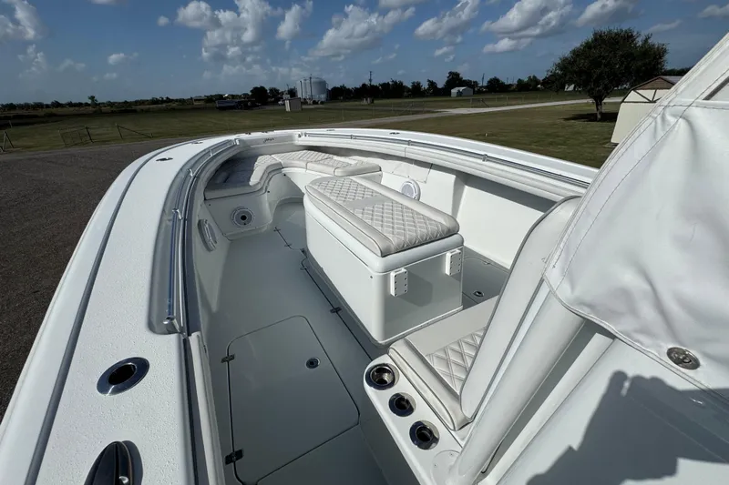  Yacht Photos Pics 2020 Yellowfin 36 Offshore boat interior with white seating and clear sky background.