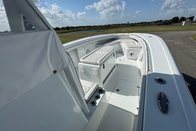  Yacht Photos Pics 2020 Yellowfin 36 Offshore boat interior with cushioned seating and storage compartments.