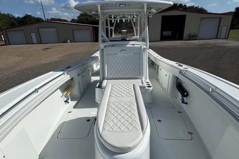  Yacht Photos Pics 2020 Yellowfin 36 Offshore boat interior with white seating and storage compartments.