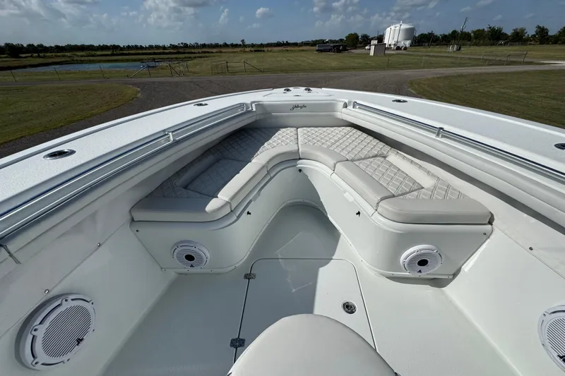  Yacht Photos Pics 2020 Yellowfin 36 Offshore boat interior with cushioned seating and speakers.