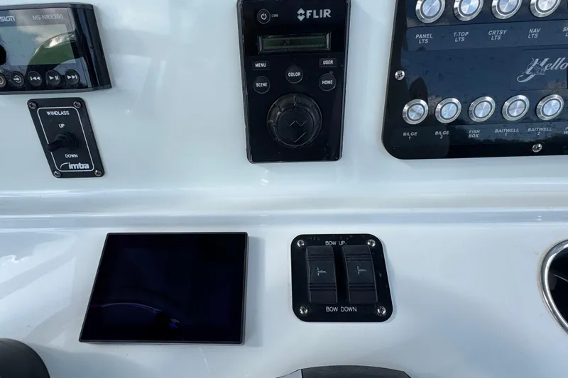  Yacht Photos Pics Control panel of a 2020 Yellowfin 36 Offshore boat with various switches and displays.
