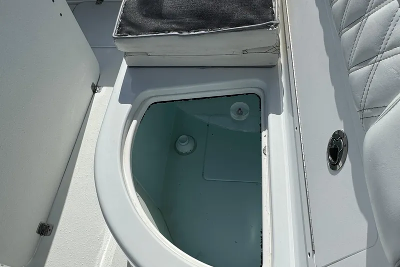  Yacht Photos Pics 2020 Yellowfin 36 Offshore boat livewell with cushioned seat and white interior.