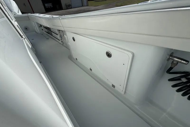 Yacht Photos Pics 2020 Yellowfin 36 Offshore boat interior, featuring storage compartments and clean deck design.