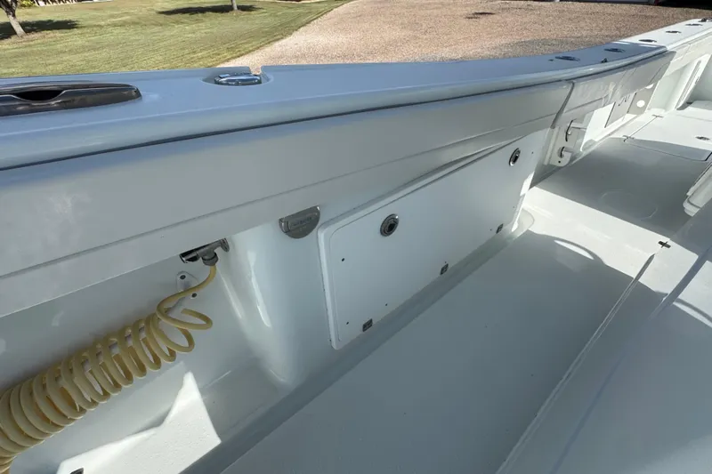  Yacht Photos Pics 2020 Yellowfin 36 Offshore boat interior with storage compartments and coiled hose.