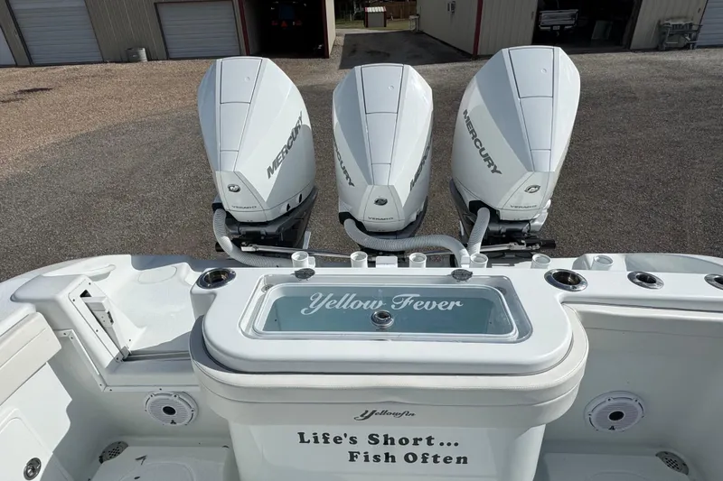  Yacht Photos Pics 2020 Yellowfin 36 Offshore boat with triple Mercury engines, "Yellow Fever" label, and fishing slogan.