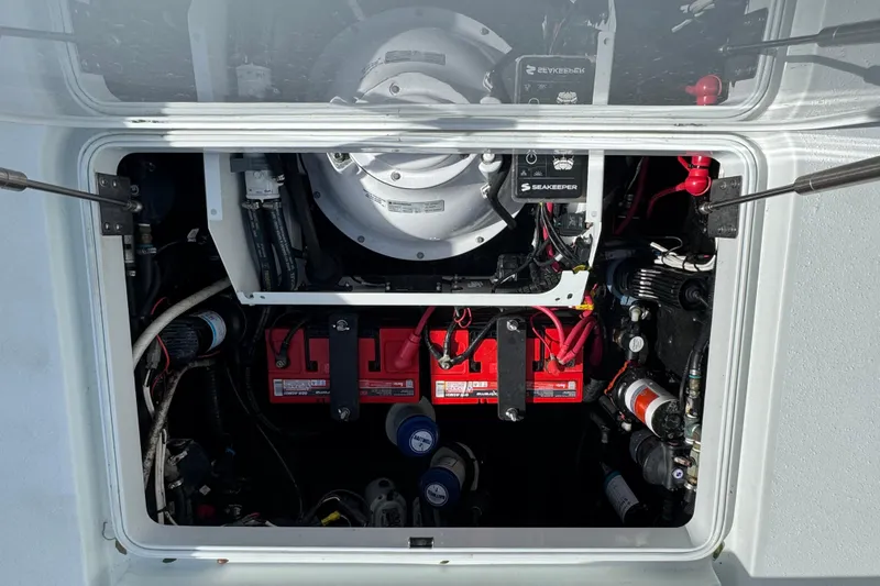  Yacht Photos Pics Engine compartment of a 2020 Yellowfin 36 Offshore boat, featuring batteries and Seakeeper system.