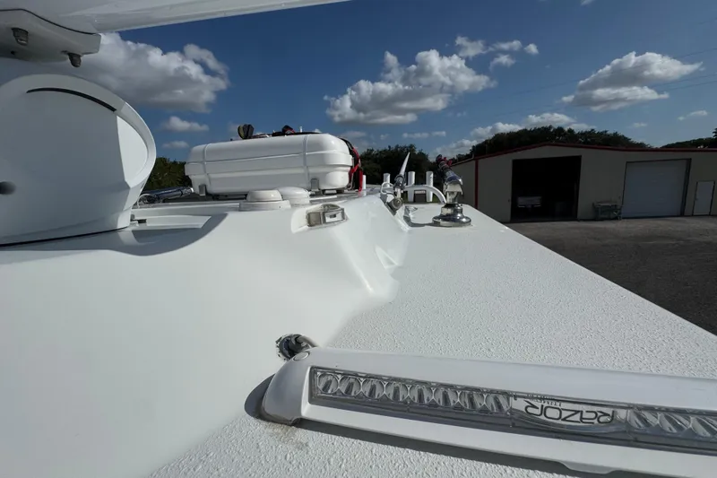  Yacht Photos Pics 2020 Yellowfin 36 Offshore boat deck with equipment under a clear blue sky.