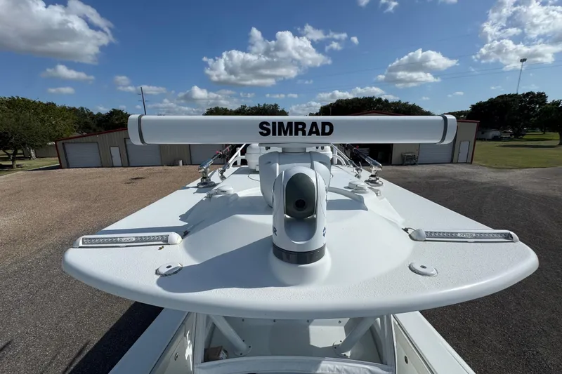  Yacht Photos Pics 2020 Yellowfin 36 Offshore boat with Simrad radar, parked outdoors under a blue sky.