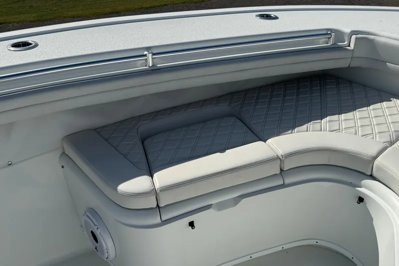  Yacht Photos Pics 2020 Yellowfin 36 Offshore boat with cushioned seating and sleek design.