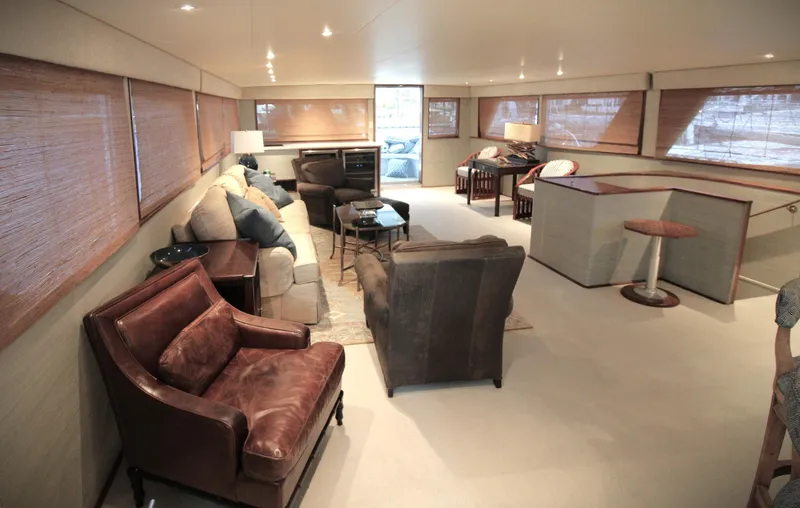 Freedom Yacht Photos Pics Luxurious interior of a 1979 Burger Raised Pilothouse yacht with elegant seating and decor.