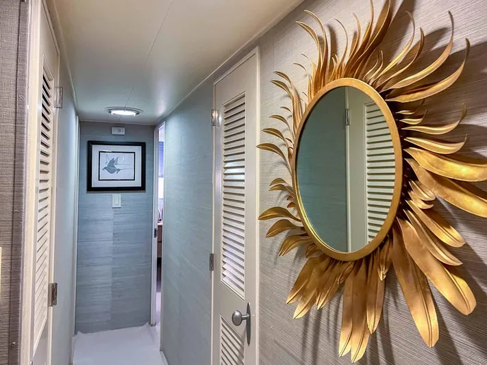 Freedom Yacht Photos Pics Hallway in 1979 Burger Raised Pilothouse with sunburst mirror and framed artwork.