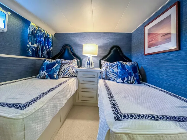 Freedom Yacht Photos Pics Twin beds in a 1979 Burger Raised Pilothouse yacht cabin with blue decor.