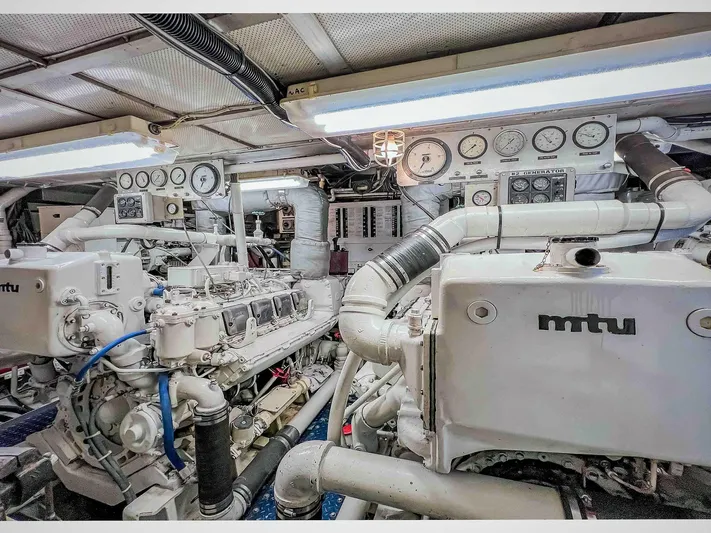 Freedom Yacht Photos Pics Engine room of 1979 Burger Raised Pilothouse yacht with MTU engines and control panels.