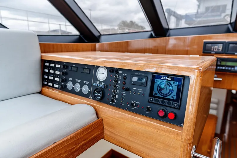 Godspeed Yacht Photos Pics Control panel of a 1998 Custom Kelly Archer boat with navigation instruments and gauges.