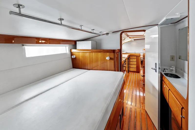 Godspeed Yacht Photos Pics Luxurious cabin interior of 1998 Custom Kelly Archer yacht with wooden finishes and modern amenities.