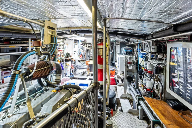 Godspeed Yacht Photos Pics Engine room of a 1998 Custom Kelly Archer boat, featuring complex machinery and equipment.