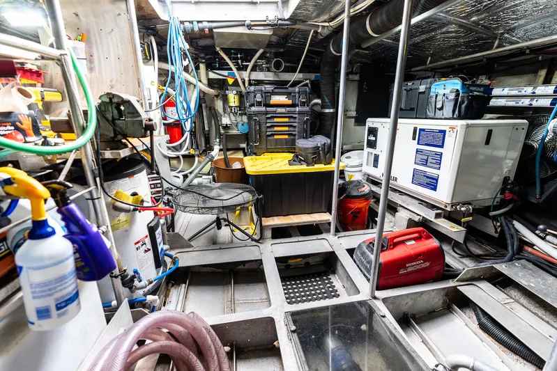 Godspeed Yacht Photos Pics Engine room of a 1998 Custom Kelly Archer boat, featuring tools and equipment.