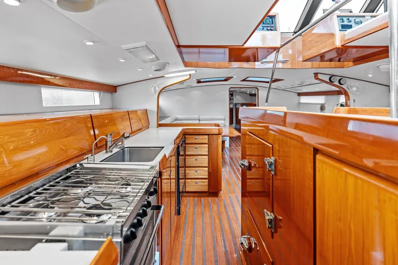 Godspeed Yacht Photos Pics Luxurious 1998 Custom Kelly Archer yacht interior with sleek wood finishes and modern kitchen amenities.