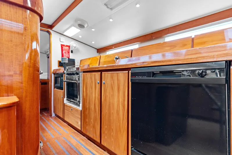 Godspeed Yacht Photos Pics Luxurious wooden interior of a 1998 Custom Kelly Archer yacht kitchen.