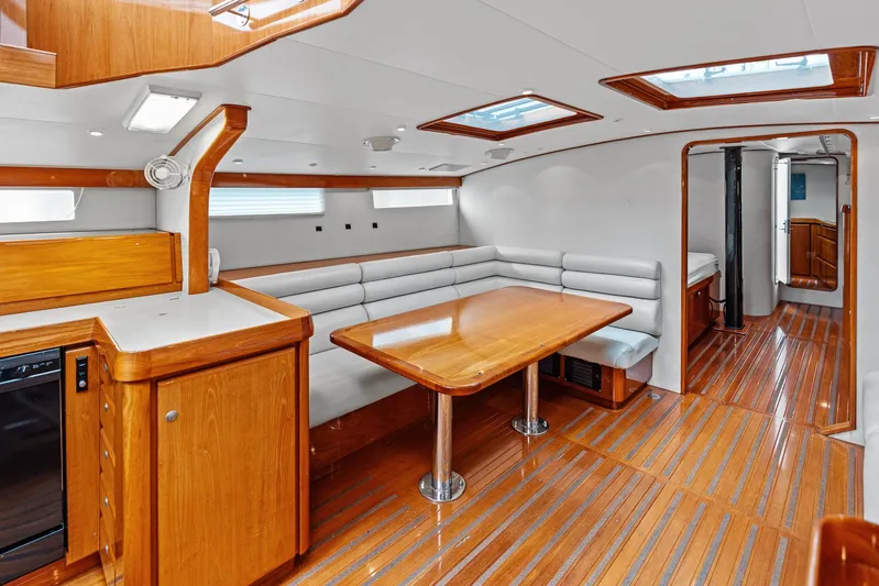 Godspeed Yacht Photos Pics Luxurious 1998 Custom Kelly Archer yacht interior with wooden flooring and modern seating area.